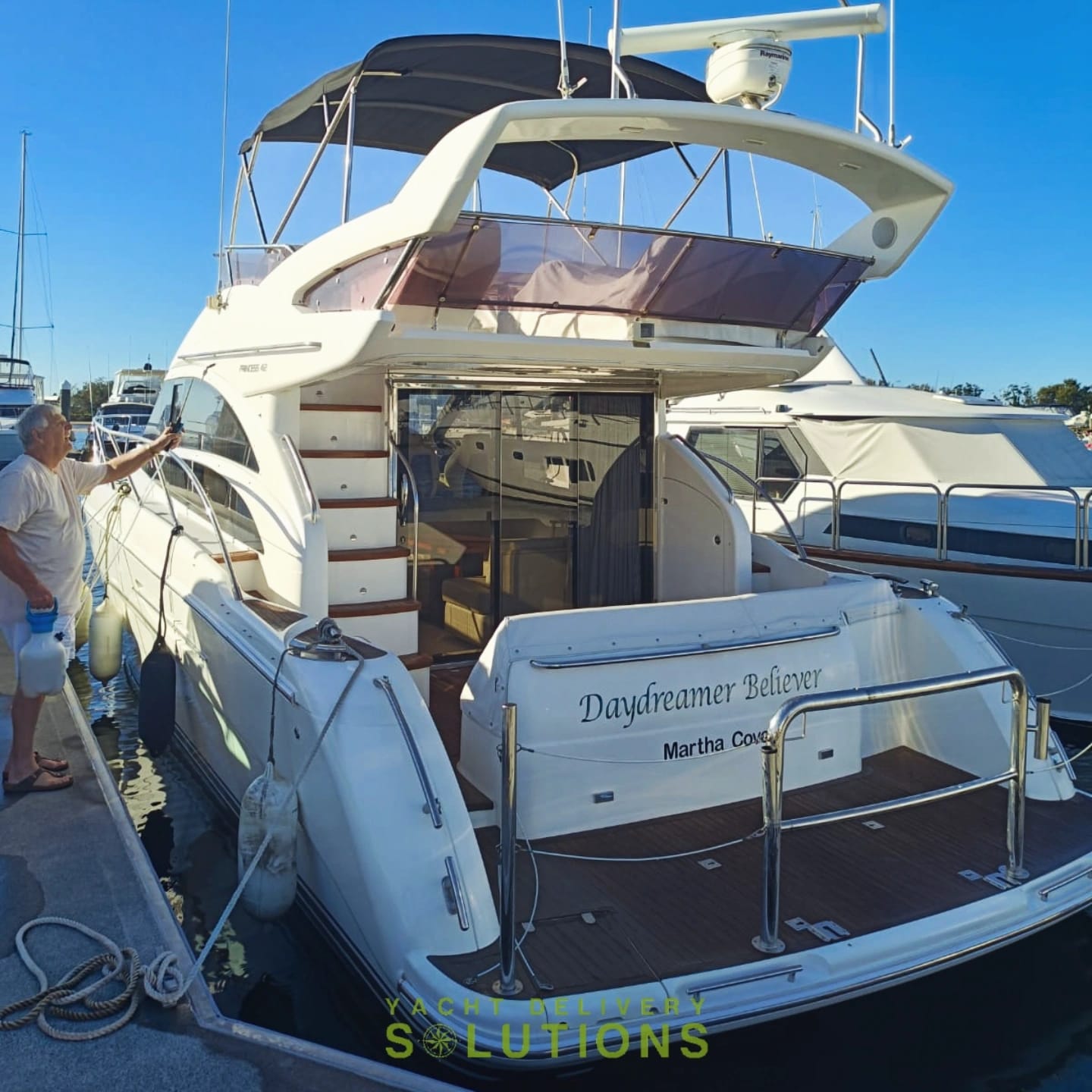 a white Princess 42 fly bridge tied to the dock after the yacht delivery to the Gold Coast