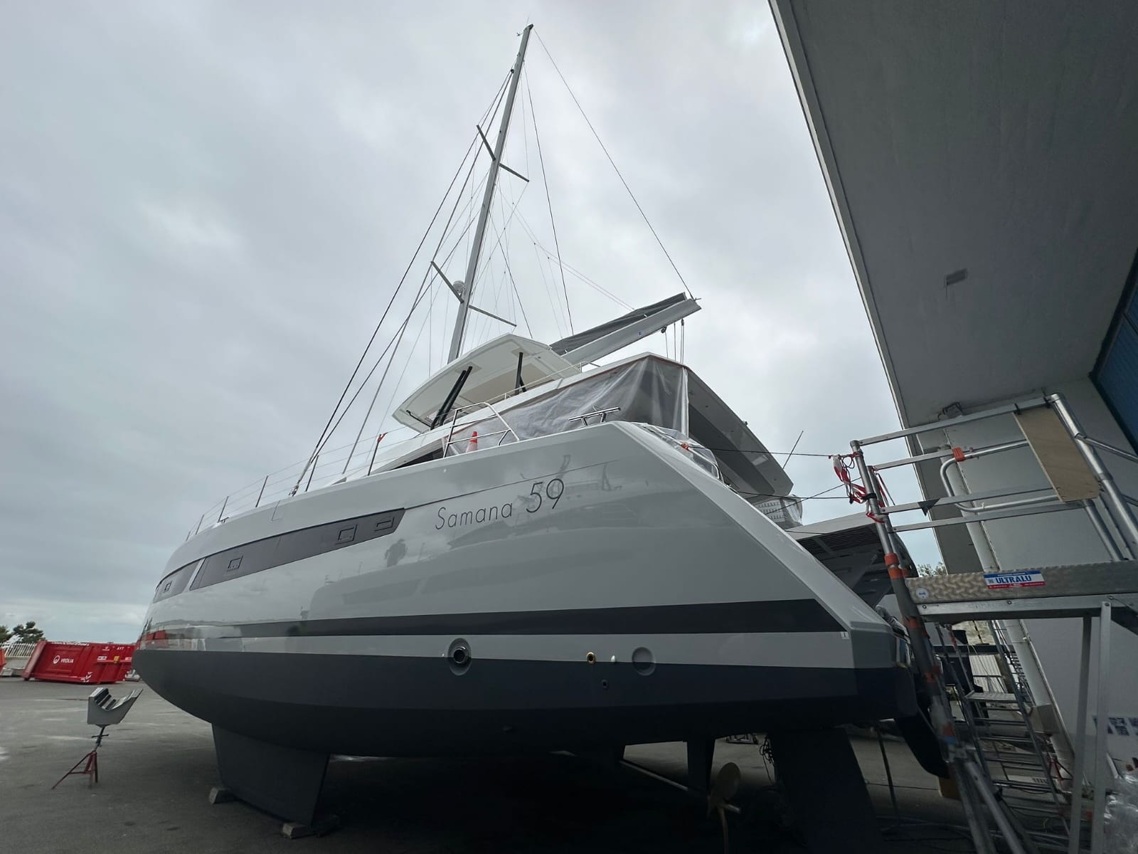 A brand new white with black antifouling fountiane Pajot Samana 59 on the hard in La Rochelle being prepared for yacht delivery solutions to take it to the caribbean