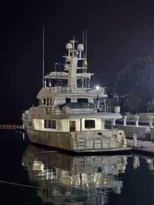 Nordhavn 76 after yacht delivery at night with the lights on