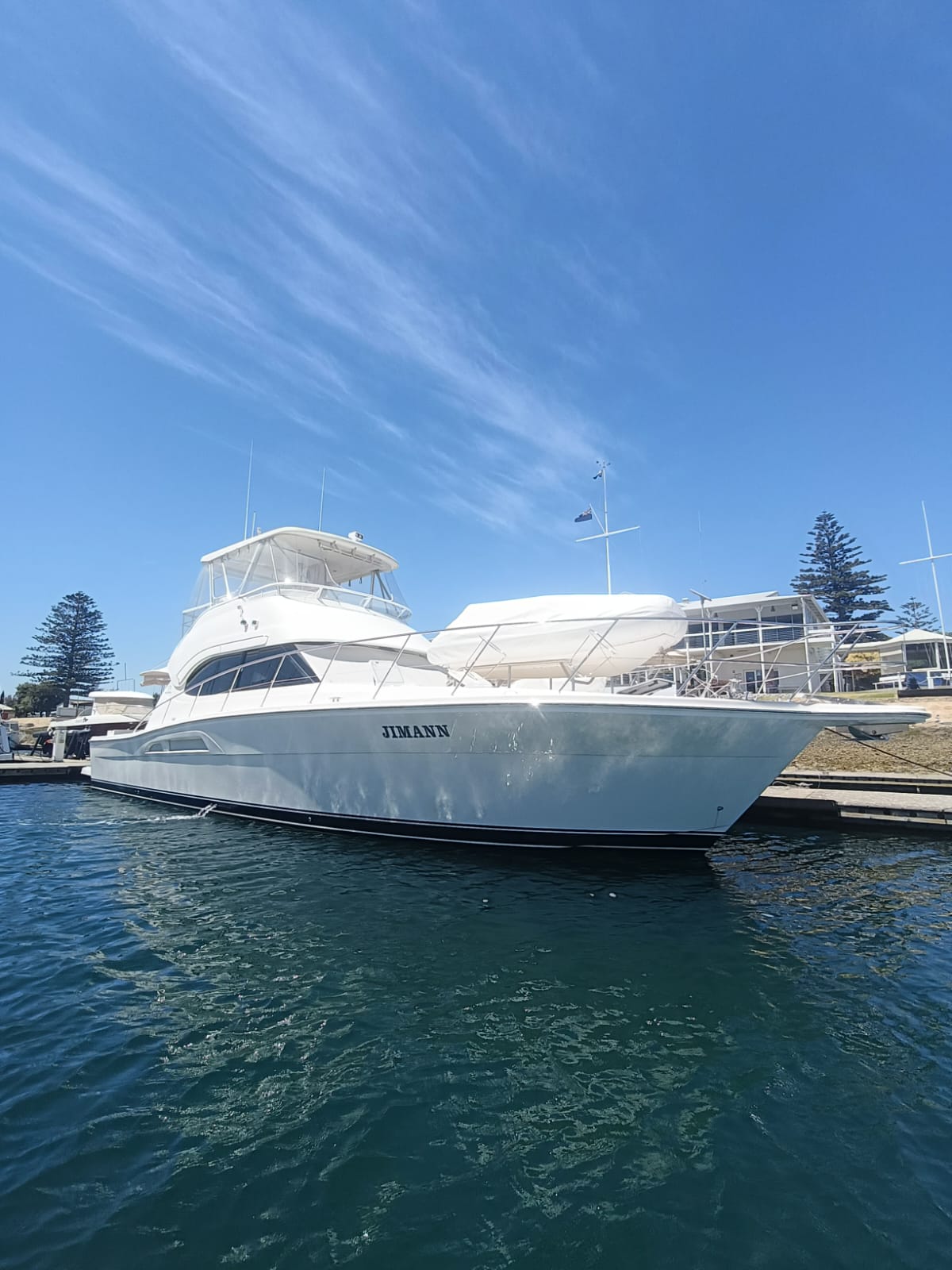 White Riviera 47 tied to a dock refueling during a yacht delivery