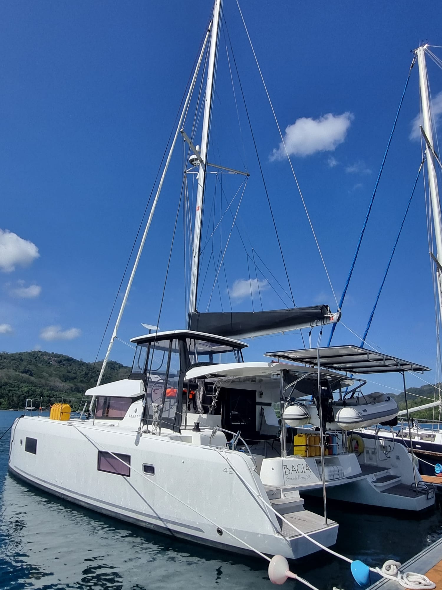 white lagoon 420 catamaran with black trim on a dock during a yacht delivery